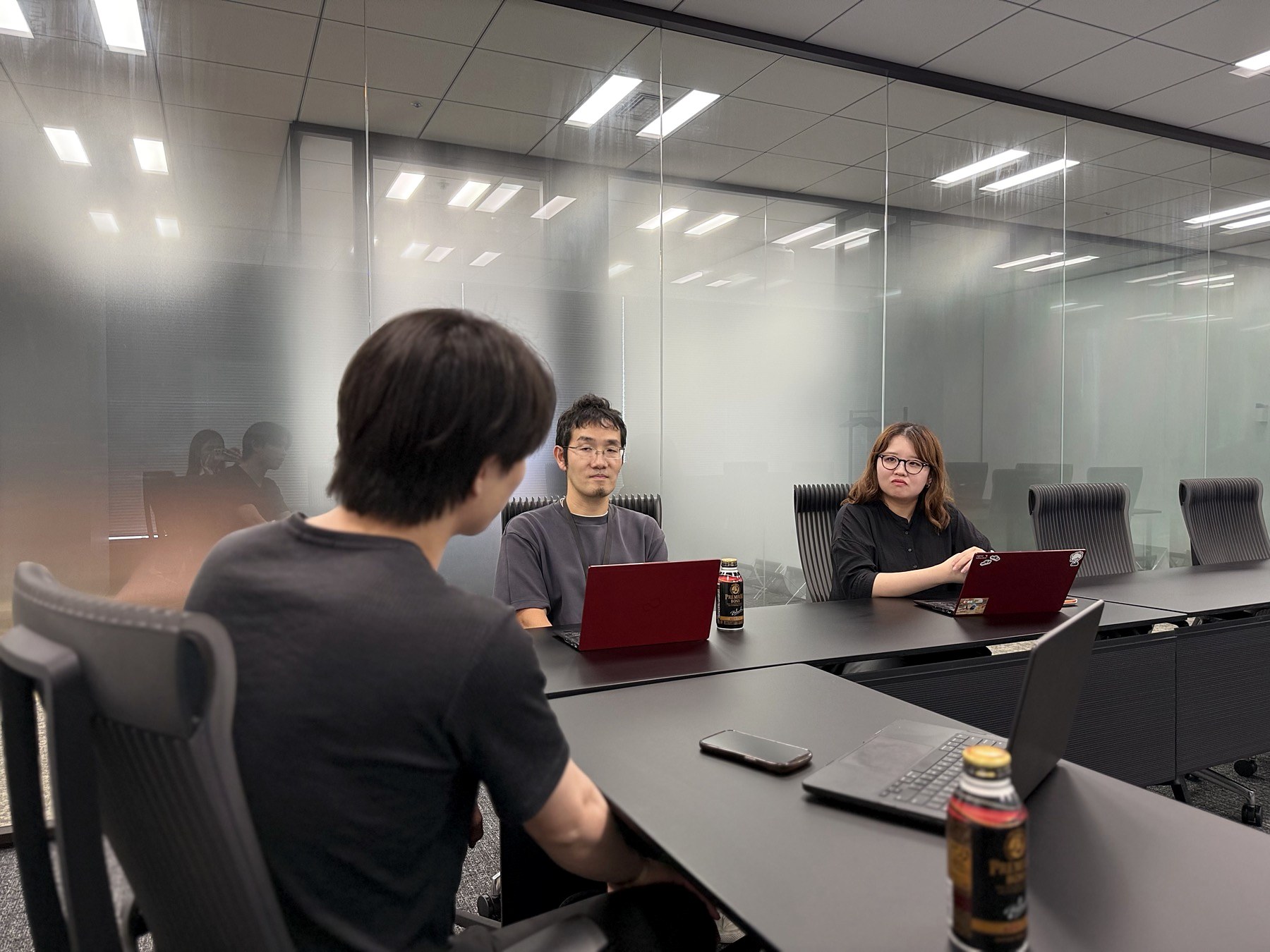 Kawashima in conversation with Mr. Matsumura and Ms. Sakaguchi